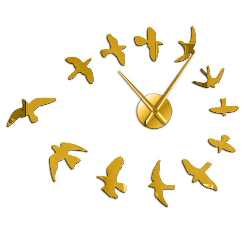 horloge design hirondelles dore